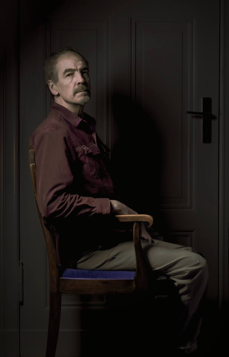 Classical Portrait of Sean sitting in a chair