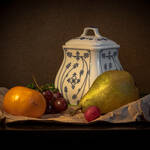 Still Life Photograph classical style with pot and fruit - pear and tangerine on a table cloth