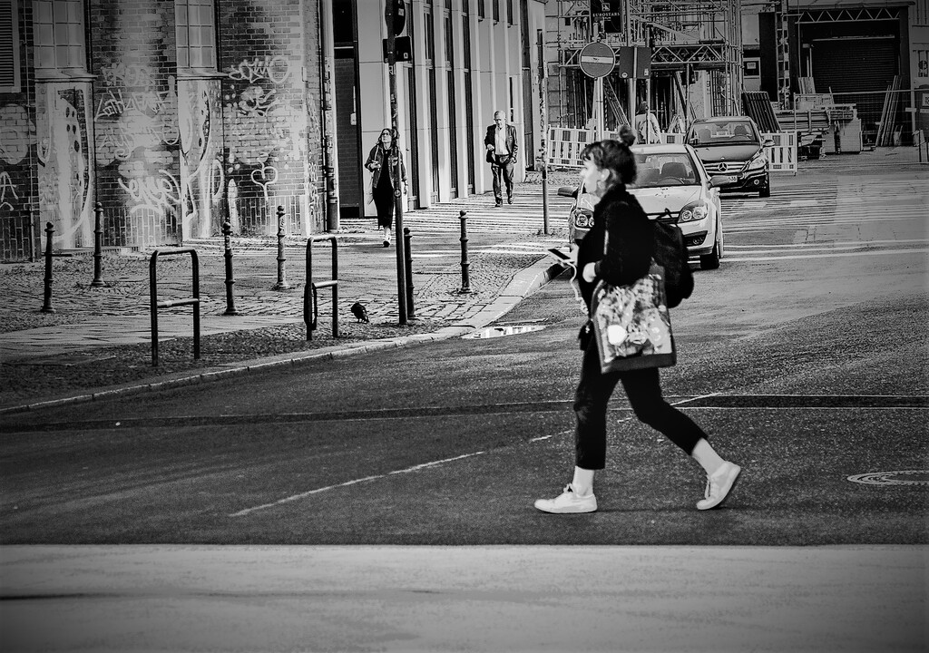 Woman walking past a bridge in Berlin, Mitte. Copyright; Sean P. Durham, Berlin, 2021