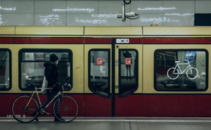 Berlin S Bahn Station with Red and mustard coloured train at the platform. Berlin Street Photography