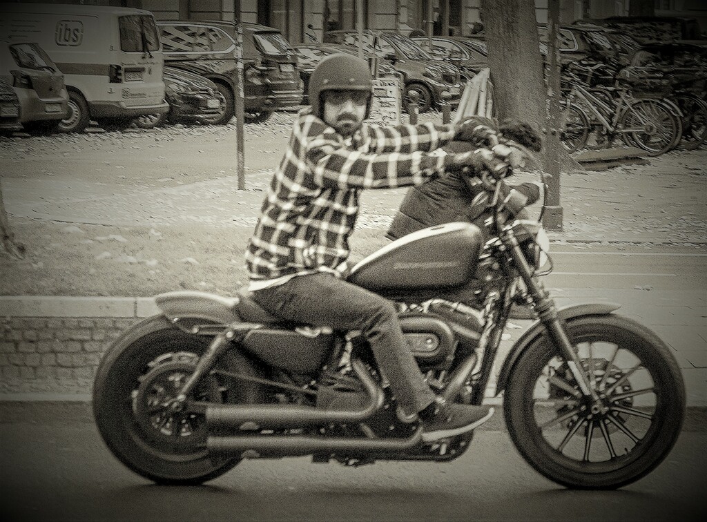 Motorcyclist on a Harley-Davidson in Berlin, Kurfürstendamm, image copyright; Sean P. Durham, Berlin, 2022