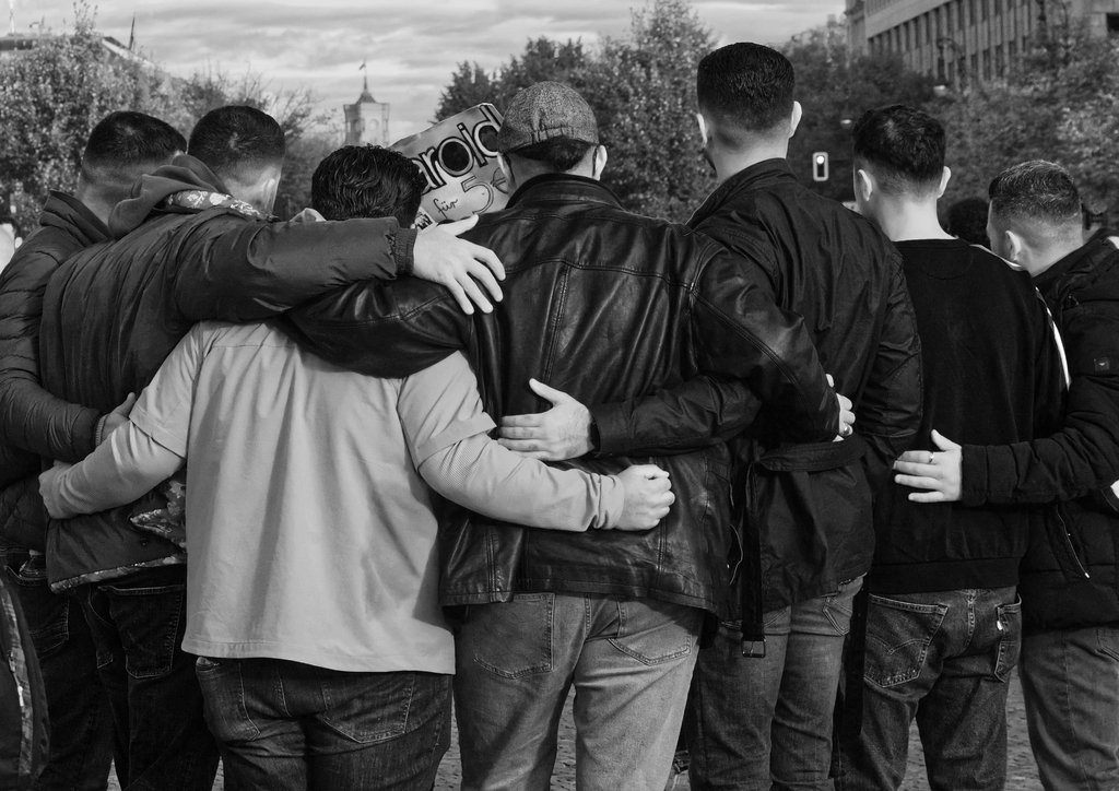 Group of men hugging for a photograph on Pariser Platz in Berlin. Autumn Days.
Copyright; Sean P. Durham, Berlin, 2023